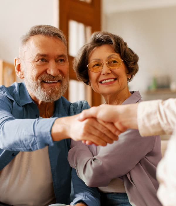 A happy couple buying a deck and patio enclosure