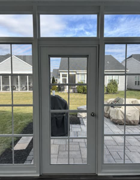 4-track-stacking-door A 4-track patio door looking out into an Ohio neighborhood.