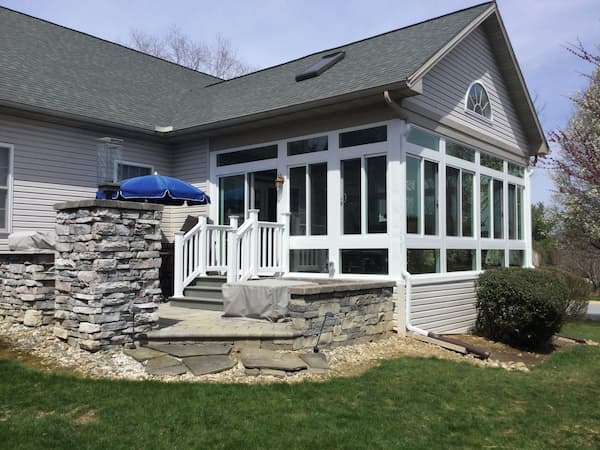 enclosed-patio-stone-porch Year Round Sunrooms keep out the Ohio winter chill